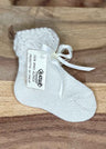 Calza neonato con fiocco in alpaca