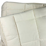 Cot quilt in natural wool and organic cotton exterior