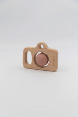 Pink camera made of wood and silicone