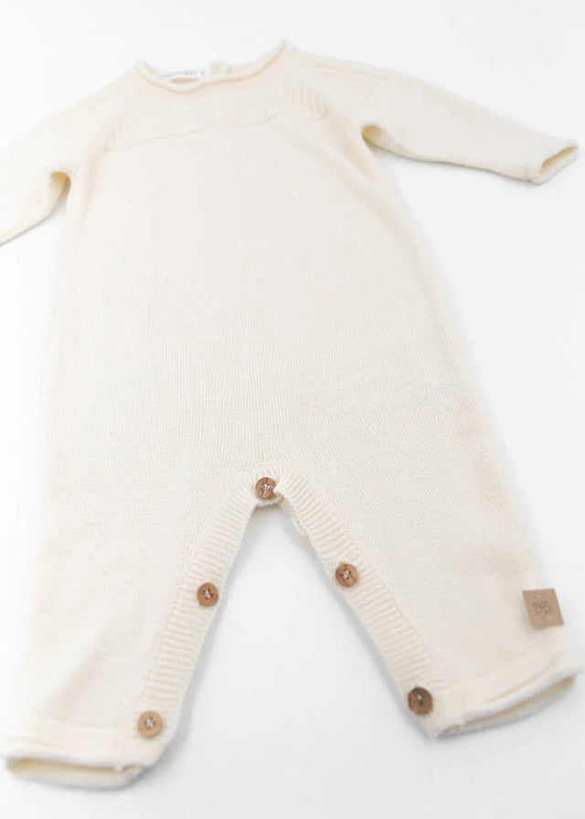 White knitted onesie for newborns in organic bamboo